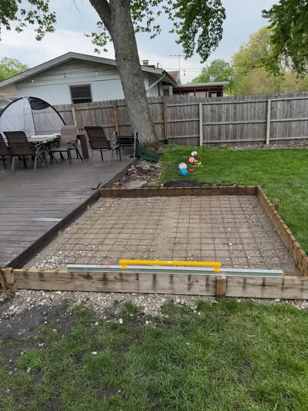 Concrete patio forms with rebar mesh ready for the pour